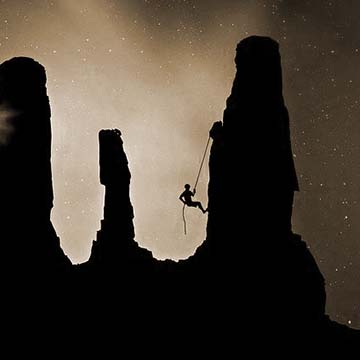 A mercury climber scales a steep wall.